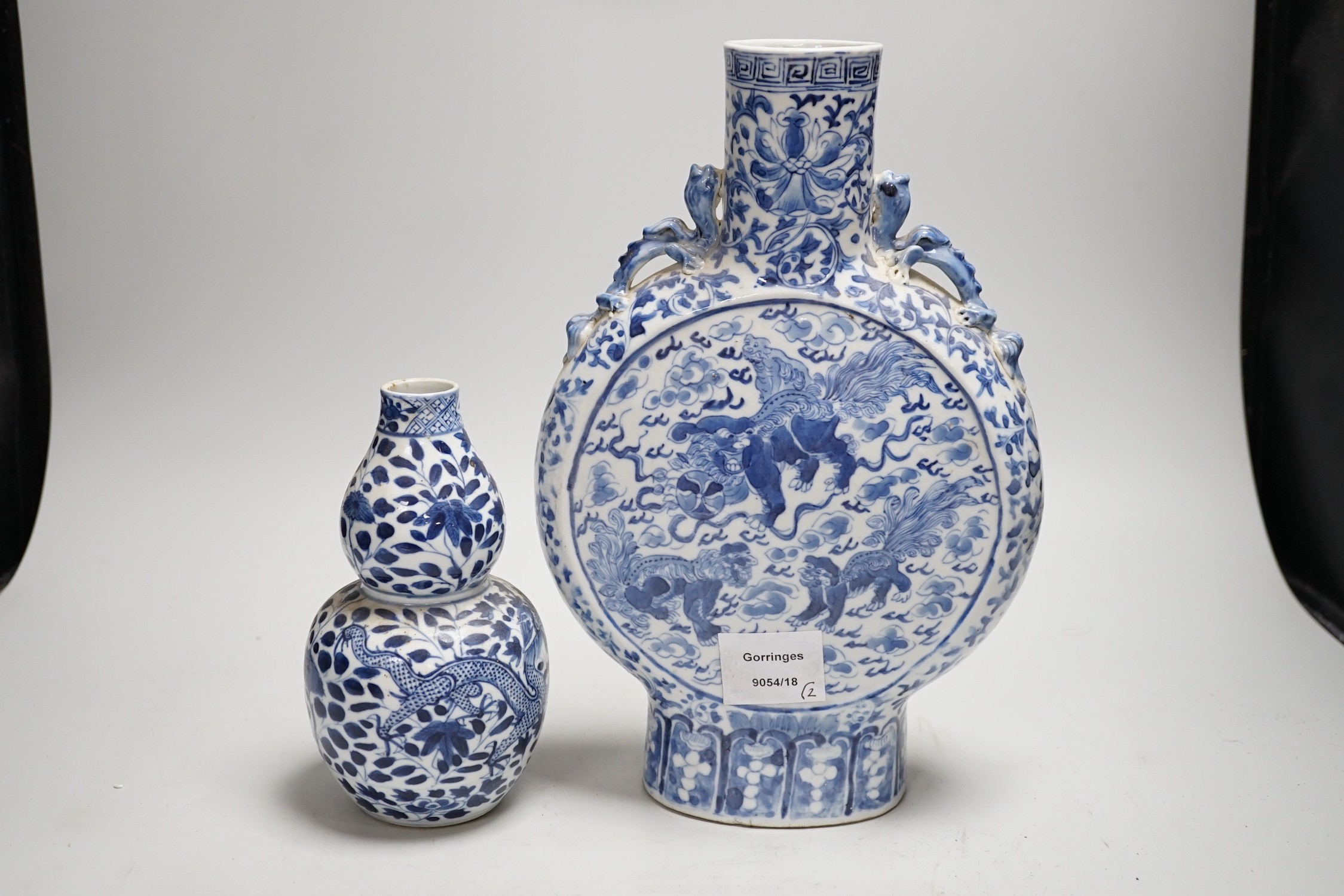 A Chinese blue and white moonflask and a similar double gourd vase, 19th century, moon flask 31cms high